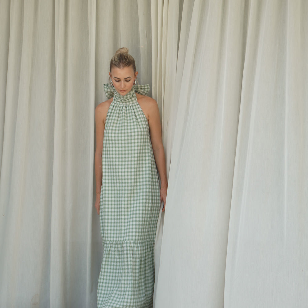 
                  
                    Audrey Bow Halter Maxi Dress in Gingham
                  
                