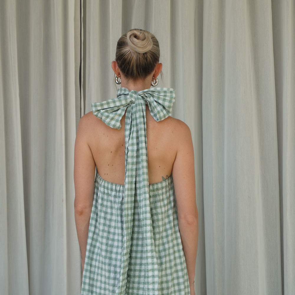 
                  
                    Audrey Bow Halter Maxi Dress in Gingham
                  
                